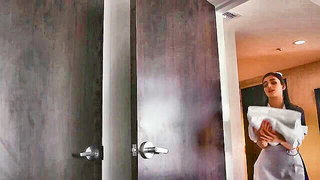 Explicit massage scene in a softly lit room