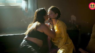 Couple mid-scene in a dim bedroom