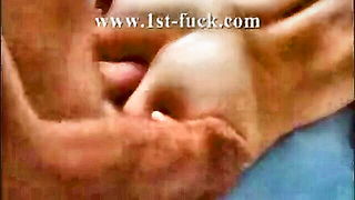 Couple mid-scene in a dim bedroom