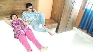 Couple on a patterned bedspread in an explicit scene
