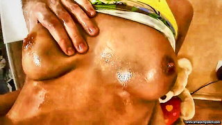 Couple on a made bed in an explicit scene