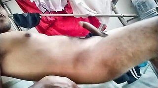 Amateur couple on a living room sofa in explicit scene