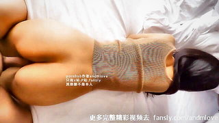 Explicit massage scene in a softly lit room