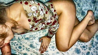 Amateur couple on a living room sofa in explicit scene