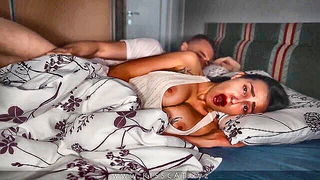 Explicit massage scene in a softly lit room