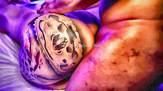 Solo performer with a toy on rumpled bedsheets