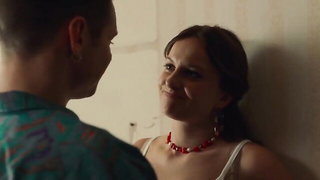 Explicit massage scene in a softly lit room