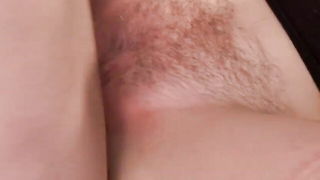 Explicit massage scene in a softly lit room