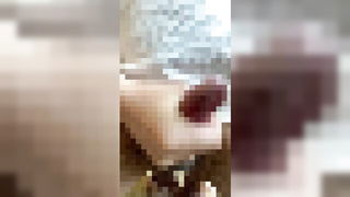 Couple on a made bed in an explicit scene