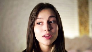 Explicit massage scene in a softly lit room