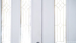 Explicit massage scene in a softly lit room