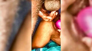 Couple on a made bed in an explicit scene