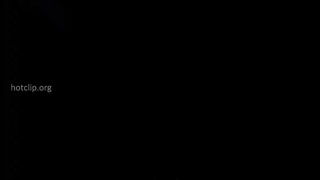 Explicit massage scene in a softly lit room