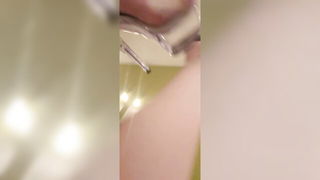 Couple on a made bed in an explicit scene