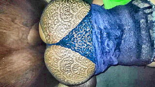 Couple on a made bed in an explicit scene