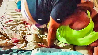 Solo performer with a toy on rumpled bedsheets