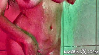 Explicit massage scene in a softly lit room