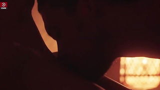 Explicit massage scene in a softly lit room