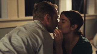 Explicit massage scene in a softly lit room