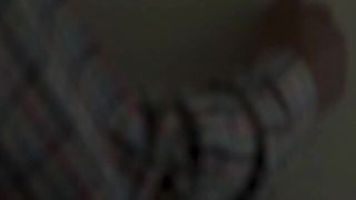 Couple on a made bed in an explicit scene