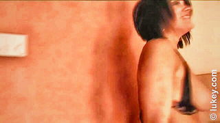 Explicit doggy style scene on a wide bed