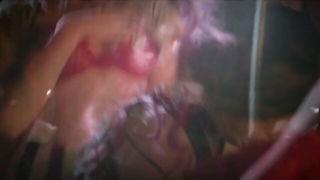 Amateur couple on a living room sofa in explicit scene