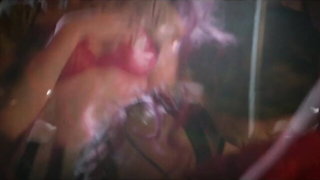 Amateur couple on a living room sofa in explicit scene