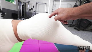Explicit massage scene in a softly lit room