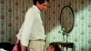 Solo performer with a toy on rumpled bedsheets