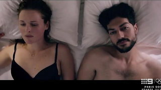 Pair of performers in motion on a wide bed