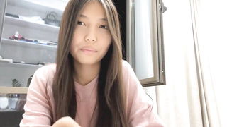 Explicit massage scene in a softly lit room