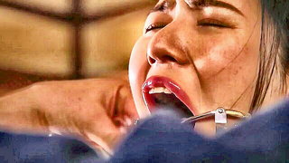 Explicit massage scene in a softly lit room