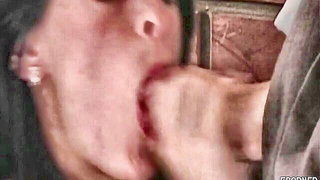 Amateur couple on a living room sofa in explicit scene