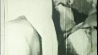 Couple mid-scene in a dim bedroom