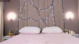 Explicit massage scene in a softly lit room