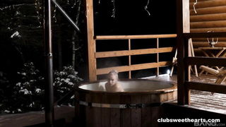 Explicit massage scene in a softly lit room