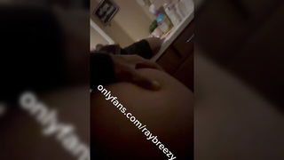 Solo performer with a toy on rumpled bedsheets