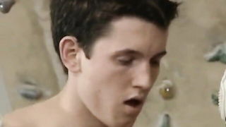 Explicit massage scene in a softly lit room