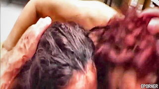 Explicit massage scene in a softly lit room