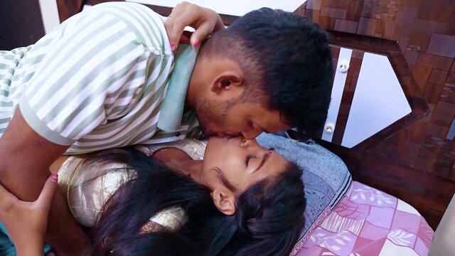 Man and woman on a rumpled bed in a Indian Blowjob movie