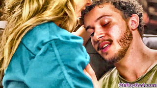 Couple mid-scene in a dim bedroom