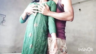 Couple on a made bed in an explicit scene