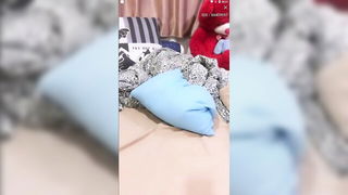 Explicit massage scene in a softly lit room