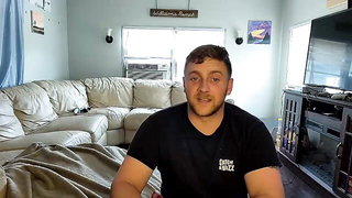 Couple mid-scene in a dim bedroom