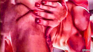 Amateur couple on a living room sofa in explicit scene