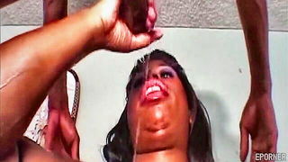 Explicit massage scene in a softly lit room