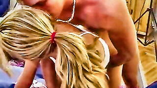 Amateur couple on a living room sofa in explicit scene