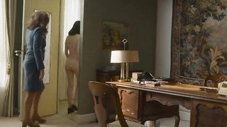 Couple on a made bed in an explicit scene
