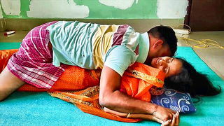 Couple mid-scene in a dim bedroom