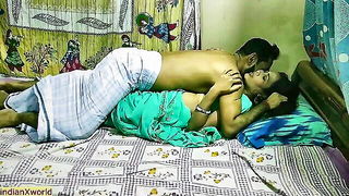 Amateur couple on a living room sofa in explicit scene